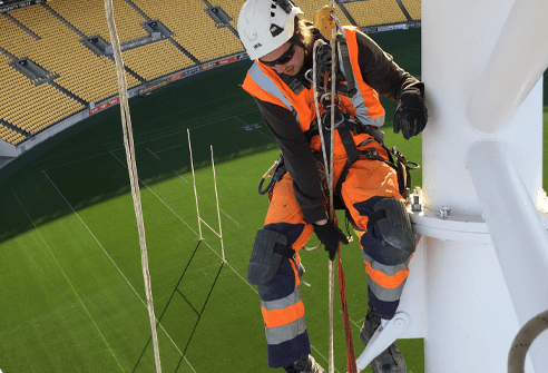 Abseil Access rope acess tech working on rugby station maintenance scope.
